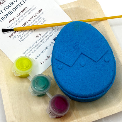 One blue Easter Egg bath bomb kit with paint containers and a brush on a white background hand made by Rusted Acre Soap Co.