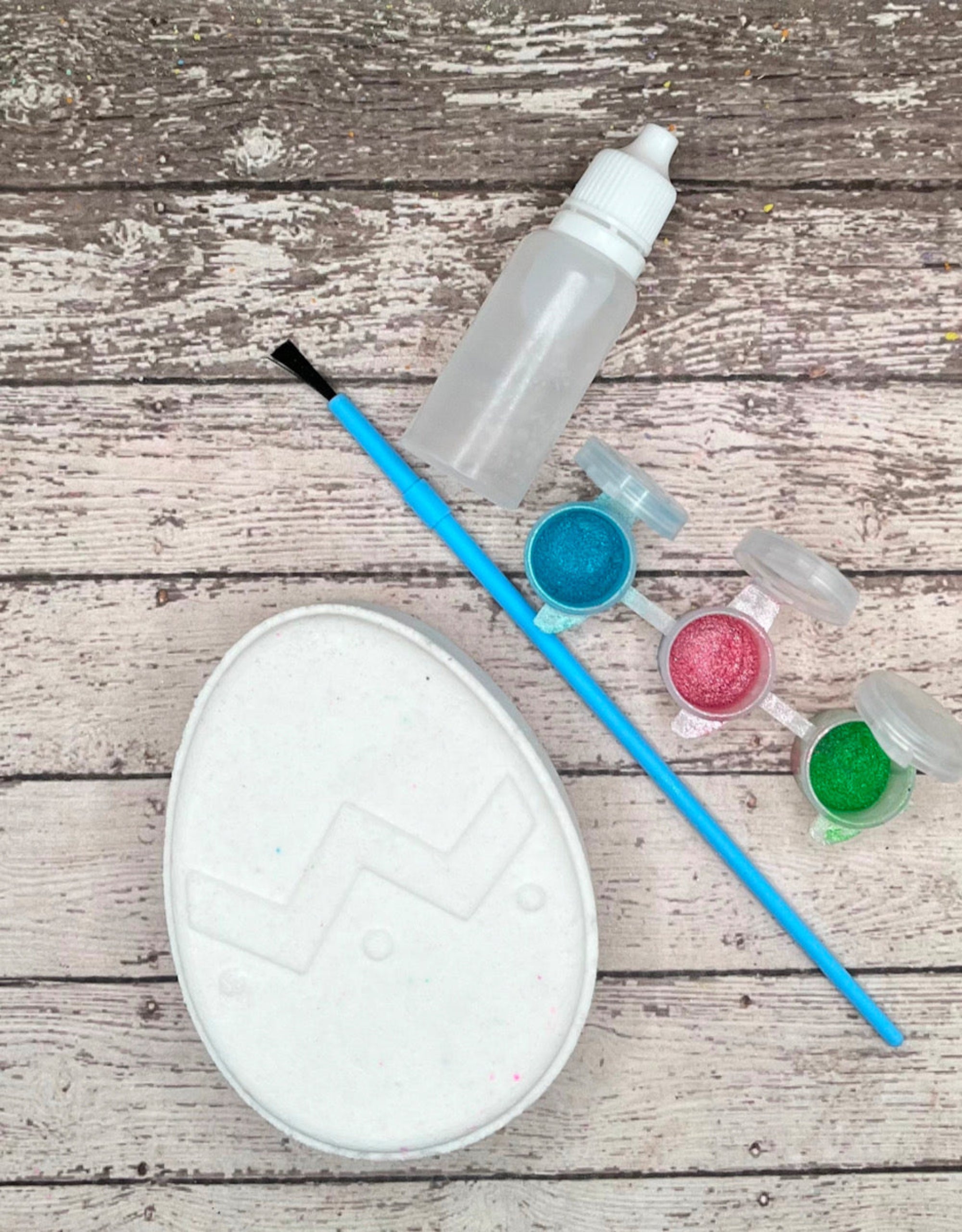 Paint your own easter egg kit with a chevron design, white bath bomb and painting supplies. Made by Rusted Acre Soap Co.