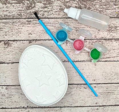 Paint your own easter egg kit with a star design, white bath bomb and painting supplies. Made by Rusted Acre Soap Co.
