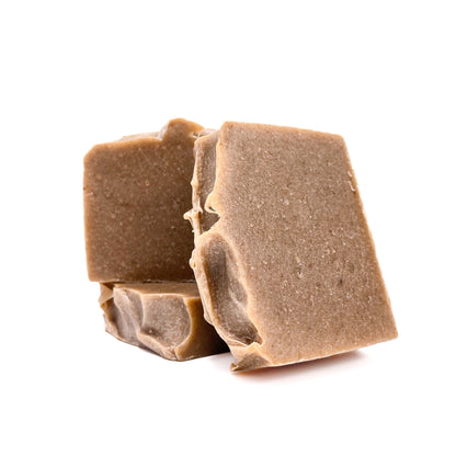 Three bars of dark tan pomegranate handmade soap from Rusted Acre Soap Company.