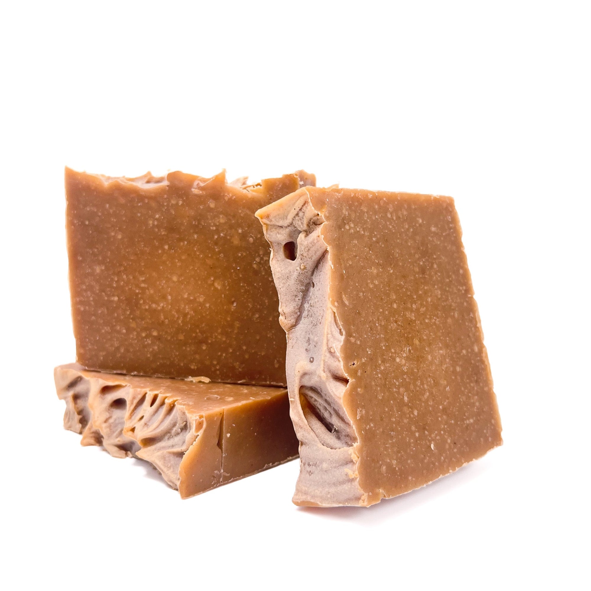 Three bars of pumpkin spice soap from Rusted Acre Soap Co. Deep orange in color.