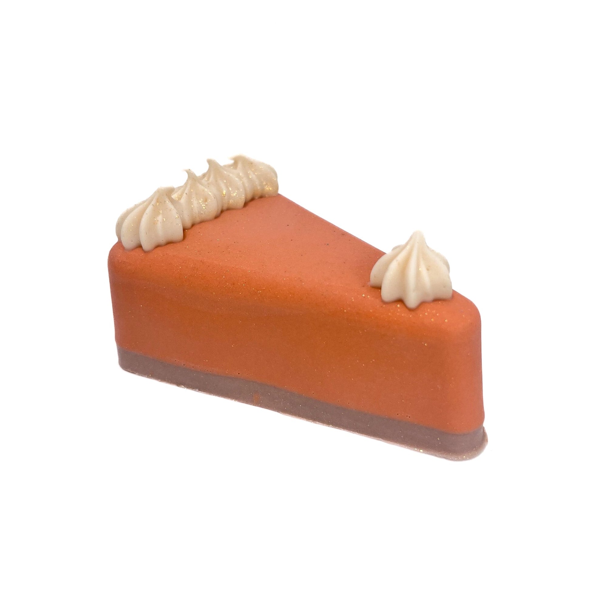 A pumpkin colored, handmade pie slice shaped soap with brown crust. Topped with cream colored soap puffs. 
