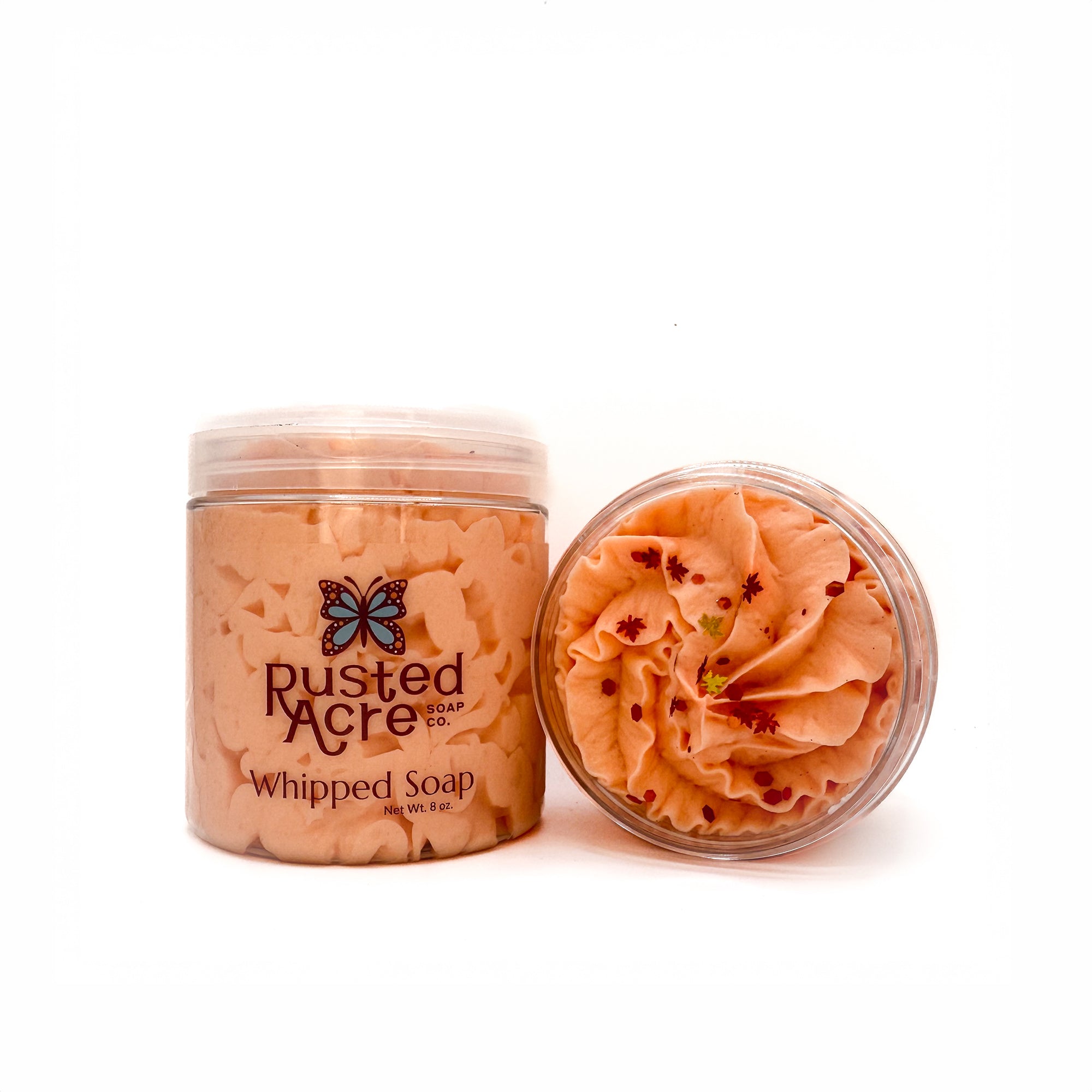 Two jars of Rusted Acre Soap Company’s pumpkin spice whipped soap front and top view.