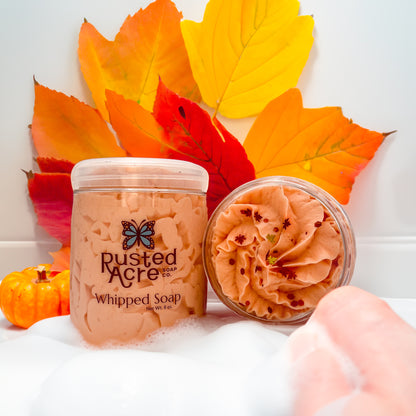 Two jars of Rusted Acre Soap Company’s Pumpkin Spice whipped soap front and top view in a lifestyle setting.