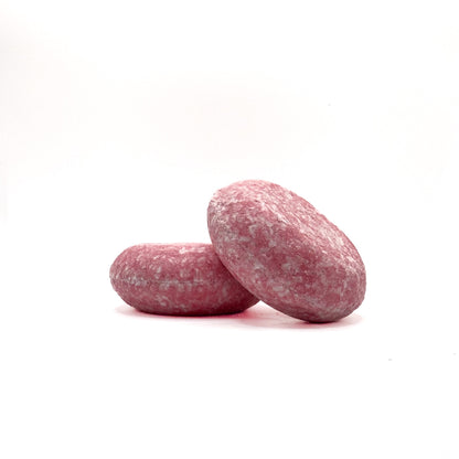 Two light pink zero waste shampoo bars in Raspberry scent from Rusted Acre Soap Company. 