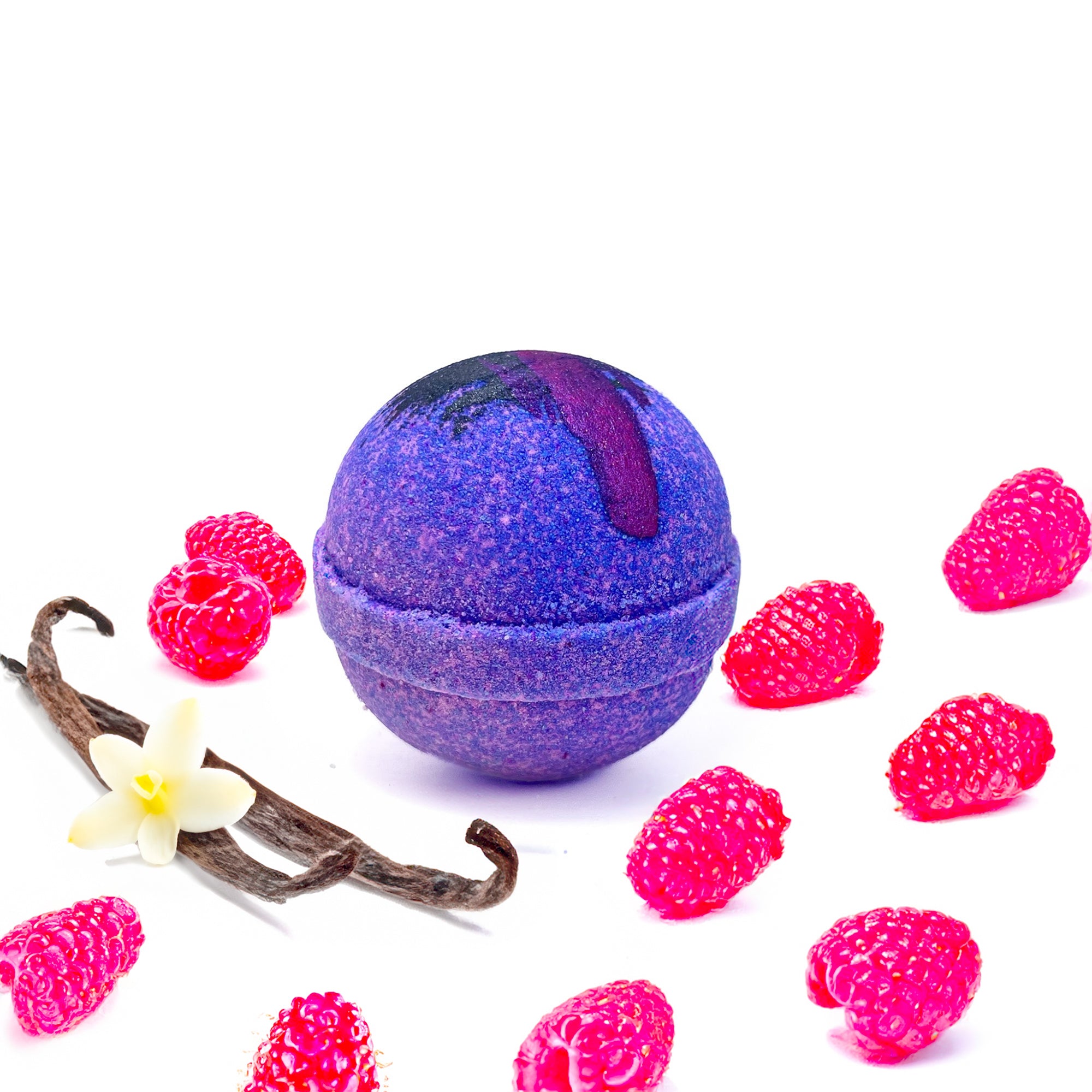A purple raspberry and vanilla bath bomb with hand painted detail hand made bt Rusted Acre Soap Company.