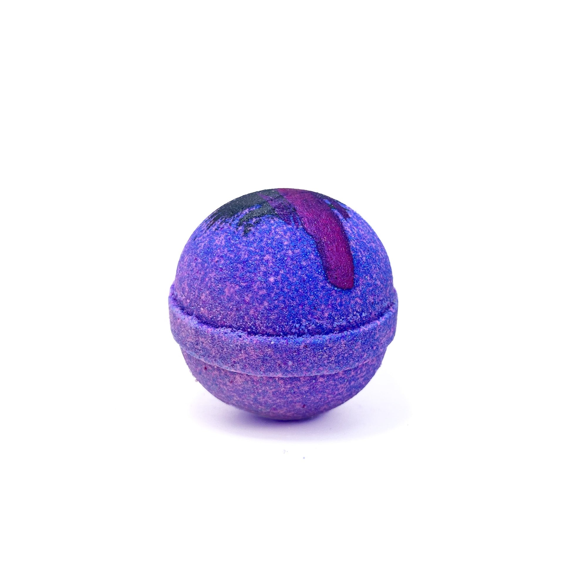 A round purple bath bomb with hand-painted purple streaks on the top, from Rusted Acre Soap Co.