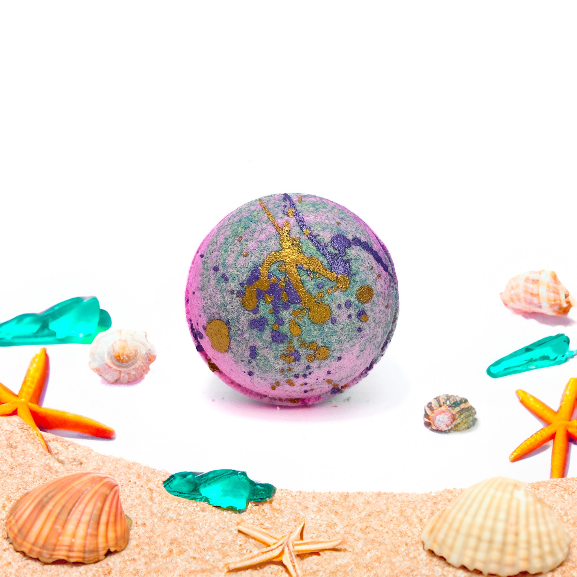 Pink and Teal bath bomb with purple and gold paint, made by Rusted Acre Soap Company. Scented with a beach aroma. 