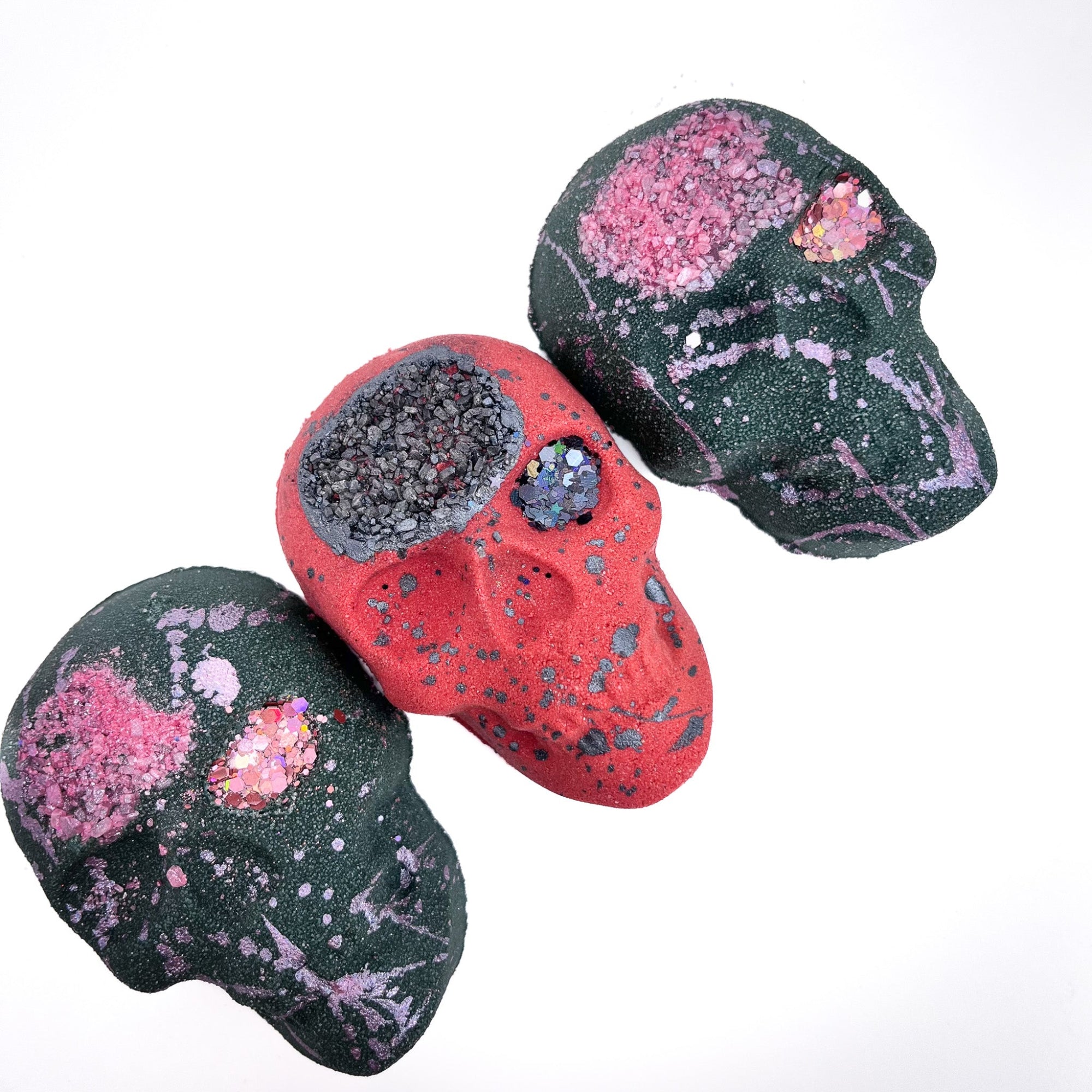 Two black boho skull bath bombs and one red skull bath bomb from Rusted Acre Soap Co. 