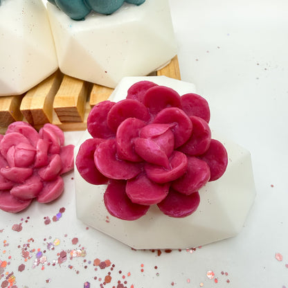 Pink succulent-shaped soap on a white heart shaped soap pot with wooden soap lift handmade by Rusted Acre Soap Co.