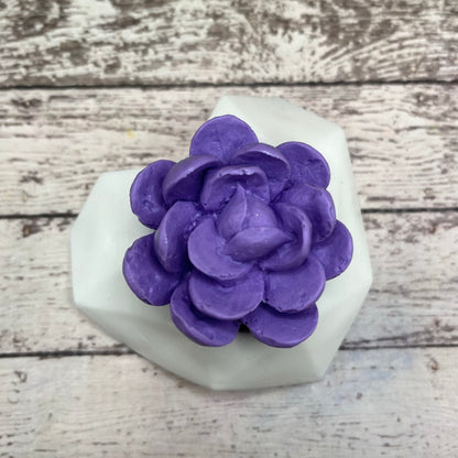 One broad leaf succulent soap with a purple flower and a white soap pot, handmade by Rusted Acre Soap Co. 