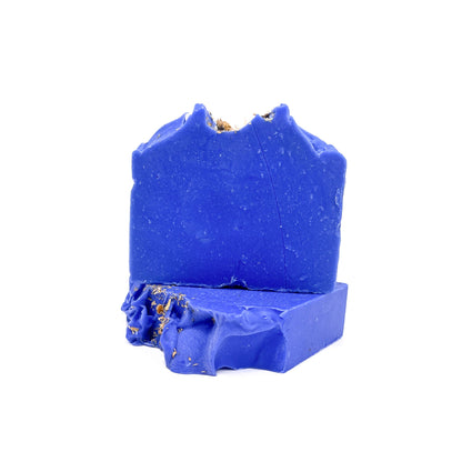 Two bars of indigo blue handmade soap from Rusted Acre Soap Co. One flat, one upright to show texture.