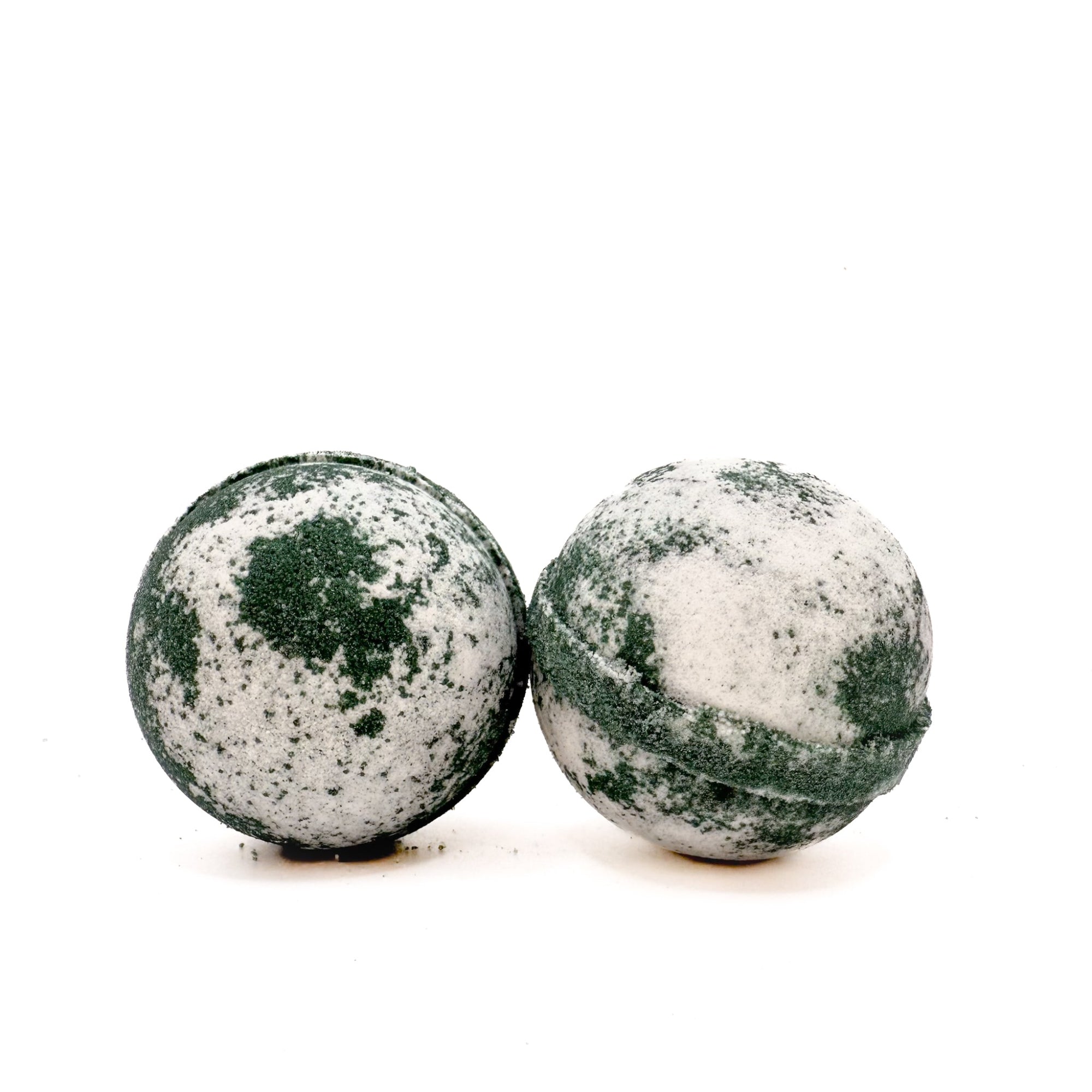 Two round Tuxedo bath bombs for men handmade by Rusted Acre Soap Co. The colors are black and white wirled.