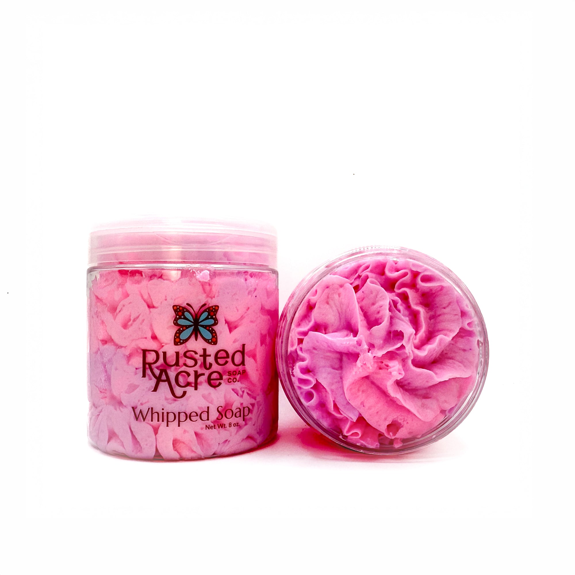 Two jars of Rusted Acre Soap Company’s unicorn dream whipped soap front and top view.