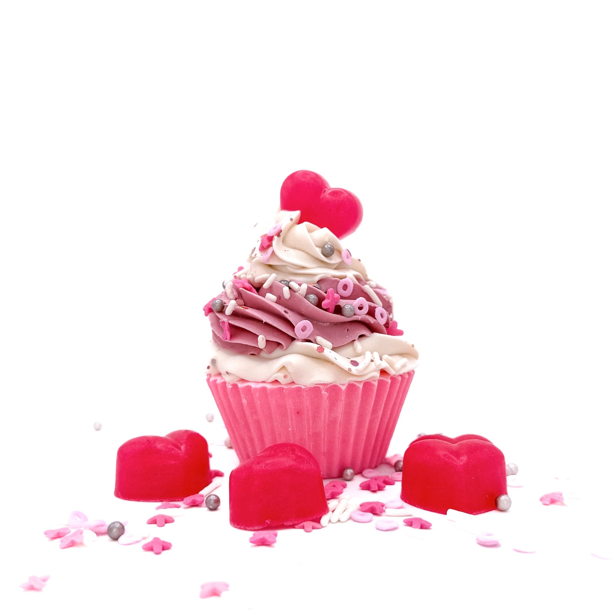 One cupcake shaped soap with pink cake and white pink swirled frosting. Topped with a soap heart and Valentines Da themed sprnkles.