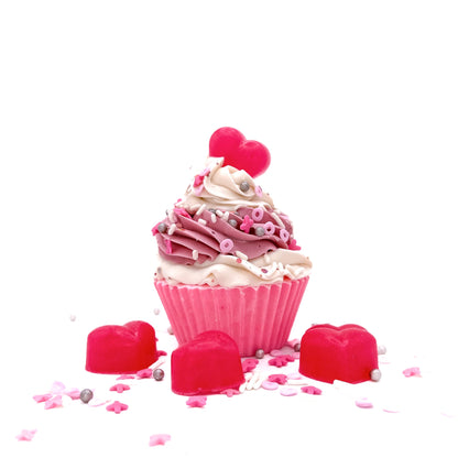 One cupcake shaped soap with pink cake and white pink swirled frosting. Topped with a soap heart and Valentines Da themed sprnkles.