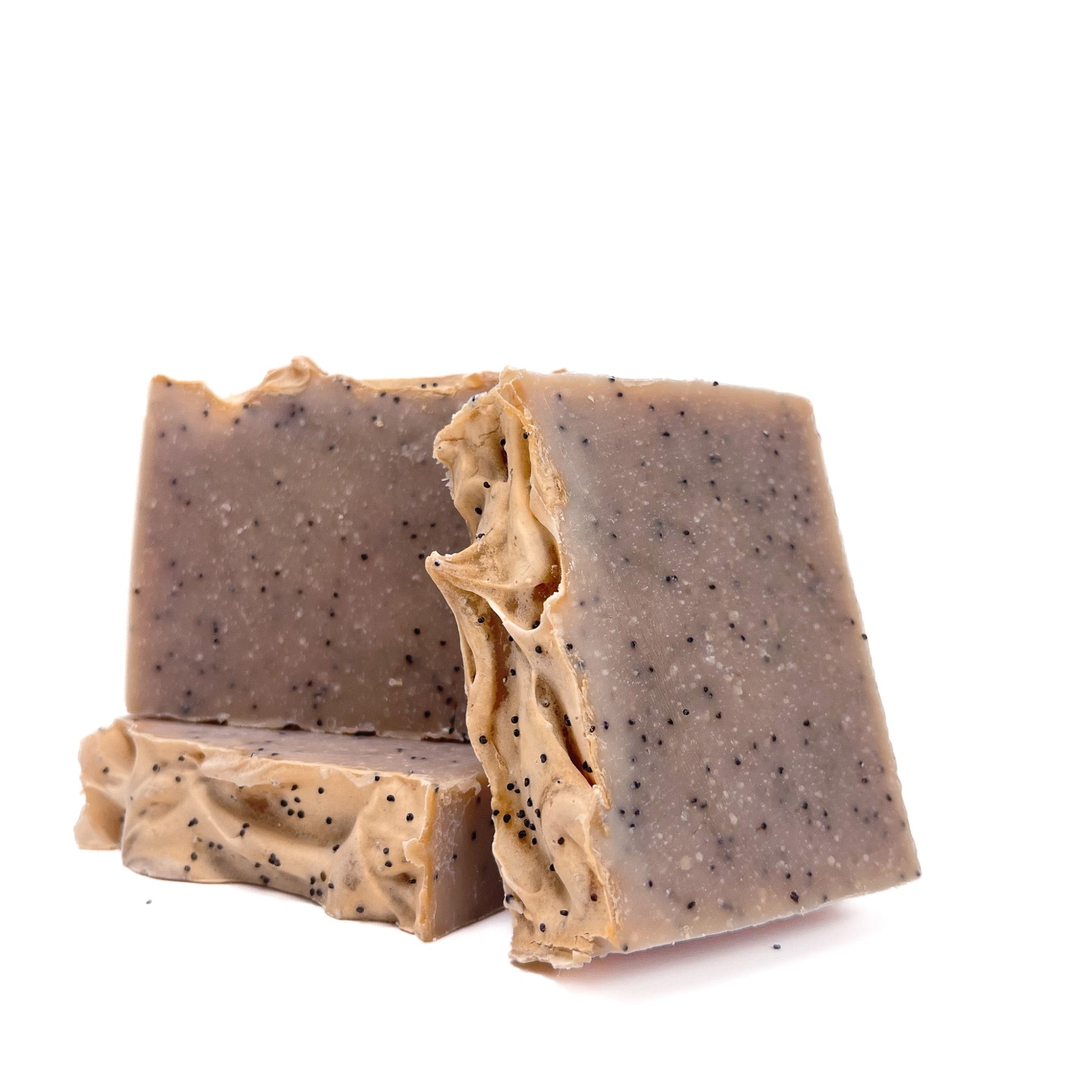 Three vanilla scented bars of handmade soap from Rusted Acre Soap Co. Creamy tan with specks of vanilla bean throughout.