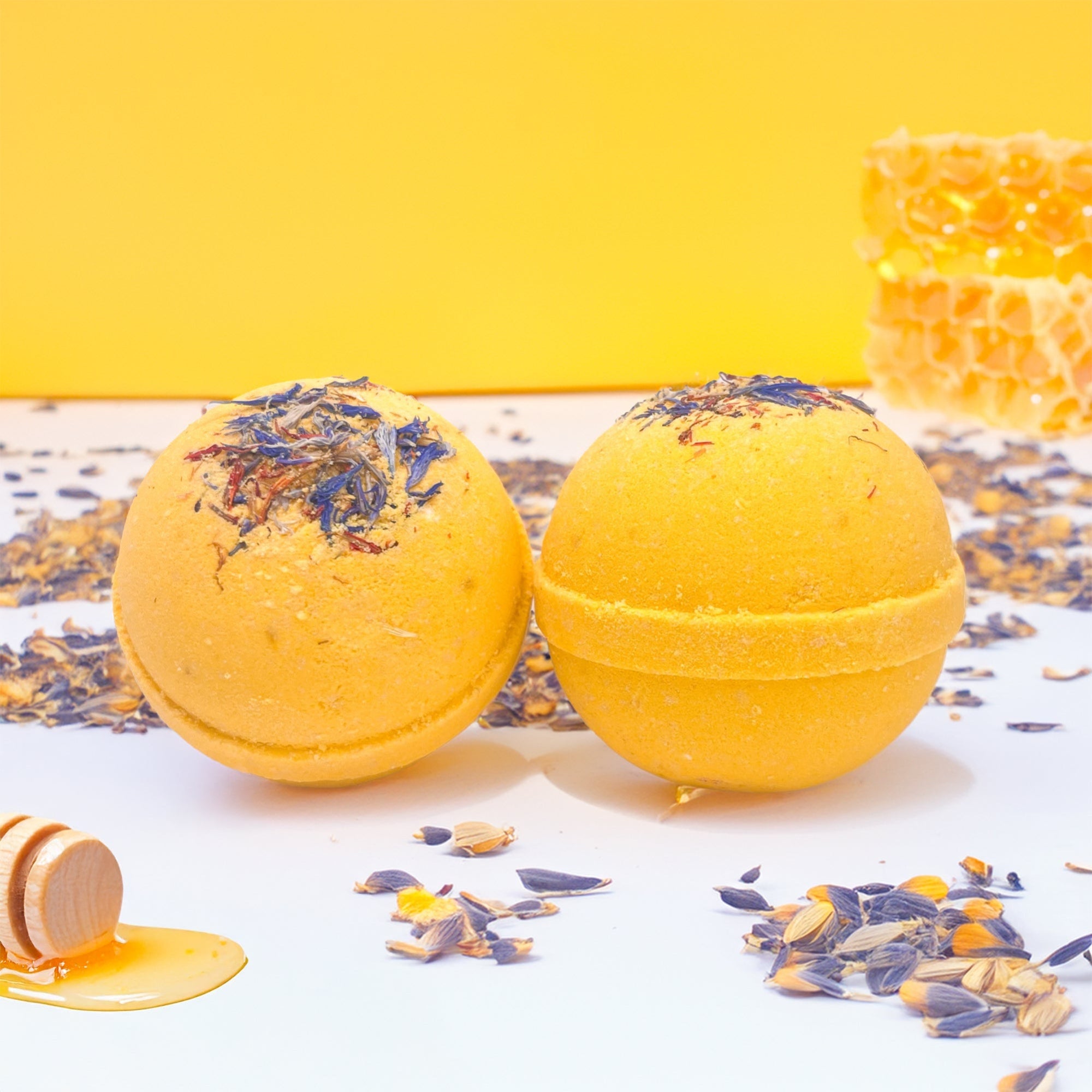 Two wildflower honey bath bombs made by Rusted Acre Soap Company.